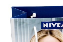 Look at the cotton cord white, knotted behind the border, Nivea bag