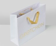 Logo, Firmenname in Gold auf Tasche